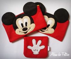 three red mickey mouse purses are shown with one in the shape of a face