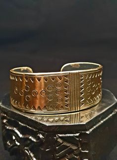 Viking bracelet! Made from brass based on originals from the Viking Age. Bracelets like these are typical of the Viking Age as a universal means of payment and jewelry. When ordering, simply specify the desired bangle, or be creative yourself, we will implement your wish in 2 mm brass. We look forward to creating your very own unique piece! Production may take up to 4 weeks. Used look or high gloss? No problem! We also need your forearm width, thickness and circumference for a custom-made product. Special requests can also be implemented! Antique Gold Adjustable Metal Bracelets, Symbolic Brass Bracelet Jewelry, Spiritual Bronze Nickel-free Bracelets, Round Brass Spiritual Bracelets, Unique Adjustable Bracelet With Antique Finish, Spiritual Round Brass Bracelets, Nickel-free Bronze Spiritual Bracelets, Unique Adjustable Bracelets With Antique Finish, Adjustable Bracelet With Antique Finish