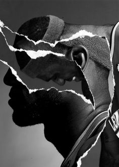 two black men with torn faces and one has a watch on his wrist