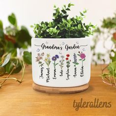 a potted plant with the words grandma's garden on it sitting on a wooden table