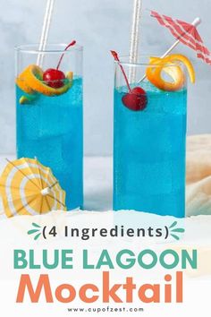 two glasses filled with blue lagoon cocktail on top of a table