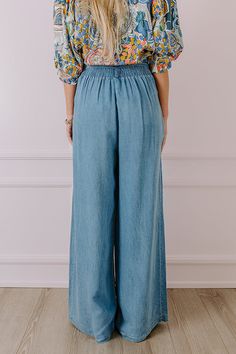 - Go with this flow in these trendy pants! - Unlined chambray material - A waistline with an elastic back, belt loops, and a removable tie closure belt - Pleated details on front - Functional side pockets - A relaxed silhouette that ends in wide floor length hemlines Light Wash Wide Leg Pull-on Bottoms, Medium Wash Pull-on Cotton Bottoms, Denim Blue Straight Leg Bottoms With Pull-on Style, Mid-rise Denim Wide Leg Pants With Belt Loops, Denim Blue Bottoms For Spring Day Out, Relaxed Fit Medium Wash Pants For Day Out, Denim Blue Bottoms For Day Out In Spring, Trendy High Rise Bottoms With Elastic Waistband, Chic Washed Wide Leg Pants