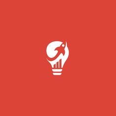 a light bulb with an image of a rocket in it's center on a red background