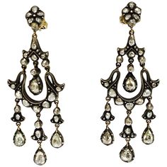 These unique antique style rose cut diamond earrings are handcrafted in 18k gold and silver. The details are as follows : Rose cut diamond weight : 6 carat Metal : 18 k gold and silver Measurements : 2.75 inch by 1 inch Fine Jewelry Earrings, Diamond Chandelier Earrings, Diamond Chandelier, Accessory Jewelry, Jewelry Antique, Jewel Box, Fine Jewelry Designers, Fine Jewellery Earrings, Rose Cut Diamond