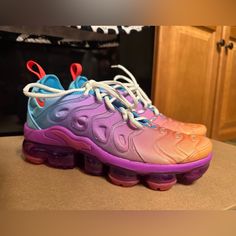 Elevate Your Shoe Game With These Nike Air Vapormax Plus Sneakers. With A Low Top Style And Colorful Gradient Design, These Shoes Are Perfect For Any Athletic Occasion. They Come In Size 6.5 And Are Part Of The Popular Nike Air Vapormax Product Line. These Sneakers Feature A Unique Style Code (Fd0823-500) And Are Perfect For Women Who Want To Make A Bold Fashion Statement. Whether You're Hitting The Gym Or Just Running Errands, These Nike Air Vapormax Plus Low Multi-Color Gradient W Shoes Will K Nike Breathable Purple Running Shoes, Purple Air Max Cushioned Lace-up Sneakers, Rainbow Color Sporty Sneakers, Sporty Purple Running Shoes With Air Cushioning, Nike Air Max Multicolor Sneakers, Vibrant Sports Sneakers With Round Toe, Purple High-top Running Shoes With Cushioned Footbed, Rainbow Sporty Synthetic Sneakers, Rainbow Synthetic Sporty Sneakers