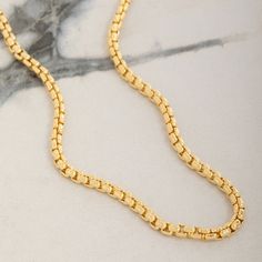 Meticulously crafted from solid 14 karat yellow gold, the 3mm Round Box Chain exudes timeless elegance and sophistication. This intricately crafted chain features a smooth design that enhances its natural luster, creating a captivating shine with every movement. Designed to be the perfect gold necklace for men, its solid and durable links promise long-lasting strength and comfortable wear for any occasion. Whether worn on its own or with a pendant, this chain's rounded design offers a refined to Classic Gold Plated Rolo Chain Necklace, Classic Gold-plated Rolo Chain Necklace, 14k Gold Box Chain Necklace With Rectangular Links, 14k Yellow Gold Box Chain Necklace, Yellow Gold Plated Box Chain Necklace, Yellow Gold Necklaces With Rectangular Box Chain, Yellow Gold-plated Box Chain Necklace, Yellow Gold Round Chain Necklace With Box Chain, Yellow Gold Chain Necklace With Solid Link Construction