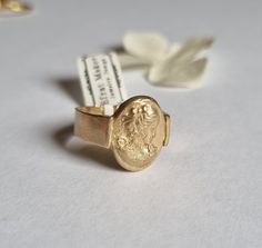 "Unique solid gold cameo Victorian signet ring in an oval design, statement pinky ring, antique style jewelry for women, available in 9k and 14k yellow gold.  This handmade gold ring is elegant and has a vintage style look. It was made by duplicating an old cameo earring, casting it into gold, and attaching it to the top of a wide band. It is available in 9k or 14k yellow gold.  This Cameo ring is a great ring for everyday wear that will compliment each of your fingers, including the pinky :) It has a unique statement and will never go out of style.  Get this timeless solid gold signet ring- you'll never want to take it off :).  Item details: 1 solid gold ring. Dimensions: Signet ring top: 0.7\"X0.4\" (1.7 cmX1.2cm) Band thickness: 0.039\" (1mm) Band width: 0.2\"  (5mm) Materials: 9k yello Gold Oval Signet Ring With Intaglio, Oval Antique Signet Ring As Gift, Gold Oval Cameo Rings, Antique Oval Signet Ring For Gift, Oval Yellow Gold Signet Ring With Intaglio, Gold Oval Cabochon Signet Ring For Gift, Gold Oval Cabochon Signet Ring As Gift, Gold Oval Intaglio Ring, Gold Oval Rings With Intaglio Detail