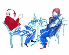 two people sitting at a table with wine glasses