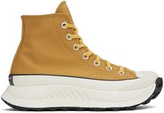 High-top cotton twill sneakers in yellow. Faux-leather logo patch at inner side. · Round textured rubber cap toe · Lace-up closure · Canvas lining · Padded CX foam footbed · Foam rubber platform midsole · Treaded rubber outsole · Platform: H1.5 in Supplier color: Burnt honey/Thriftshop yellow Burnt Honey, Women Attire, Converse Yellow, Sport Shoes Men, Converse Chuck 70, Best Kept Secret, Chuck 70, Outdoor Men, Converse Sneakers