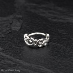 Beautiful Sterling silver nose ring for pierced nose. Tribal, ethnic, delicate design. Can be worn as an earring for the tragus, helix, earlobes & septum ring as well Material: Sterling silver 925 Wire Thickness: 0.8 mm - 20g Diameter of the ring: - 0.27Inc - 7mm *Nickel-free For other nose rings- https://www.etsy.com/shop/Umanativedesign?section_id=16881369&ref=shopsection_leftnav_6 We offer a range of septum rings, for pierced and non- pierced noses, made of different materials. You ca Silver Hoop Nose Ring For Wedding, Silver Hoop Septum Ring For Anniversary, Hypoallergenic Small Hoop Nose Ring For Wedding, Hypoallergenic Adjustable Septum Ring For Weddings, Silver Sterling Silver Nose Rings For Wedding, Sterling Silver Septum Ring For Wedding, Nickel-free Sterling Silver Nose Rings For Wedding, Nickel-free Septum Ring For Wedding, Nickel Free Hoop Septum Ring For Wedding