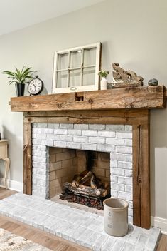 a fire place in a living room with a clock on the mantle and other decorations