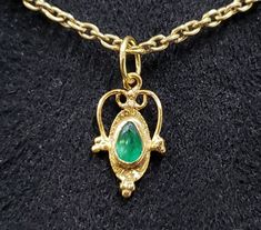 1. 18k Gold Zambian Emerald Pendant 2. Luster green  3. Gemstone - Zambian Emerald   4. Jewelry Type - Charms Pendant 5. Total Weight - 0.490 Gram Approx. 6. Emerald Weight - 0.20 Carats                7. Gold Weight - 0.450 Grams Approx. 8. Gold Purity - 18k 9. Pendant Bails Outer Size - 6 MM 10. Emerald Size - 3 x 5 MM  11. DIY Gold Accessories  12. Ready to Dispatch in 1 - 2 days. 13. Handmade Items 14. AAA Quality Pendant 15. 1 Quantity Available 16. Natural Pear Green Emerald    Pictures ar Green Necklace For May Birthstone, Gold Emerald Necklace With Hallmark, Gold Emerald Pendant Necklace With Jewels, Dainty Green Emerald Necklace For Formal Occasions, Green Dainty Jewelry, Emerald Style, Diy Gold, Minimalist Pendant, Pendant Bails