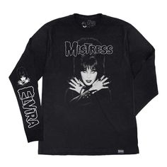 Bring some anarchy to your wardrobe with the Elvira Mistress Fiend Black long sleeve Shirt! This exclusive shirt features art inspired by the Misfits' groundbreaking Horror Business single, paying homage to horror punk scene legends. It's printed on a premium soft style feel 100% ring spun cotton long sleeve shirt. Hand printed in Los Angeles by the official Elvira's Bootique. Long Sleeve Graphic T-shirt For Concerts, Gothic Long Sleeve T-shirt For Fall, Edgy Long Sleeve T-shirt With Screen Print, Emo Long Sleeve Tops For Concerts, Grunge Long Sleeve Tops With Graffiti Print, Punk Long Sleeve Tops For Concert, Emo Long Sleeve T-shirt For Alternative Fashion, Emo Style Long Sleeve T-shirt, Long Sleeve Punk Shirt For Alternative Fashion