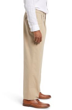 Lightweight cotton poplin elevates versatile pleated khakis in a traditional, full-tailored cut. 18" leg opening; 10" front rise Zip fly with button closure 100% cotton Machine wash, tumble dry Imported High-waisted Cotton Chinos With Welt Pockets, Formal Full-length Chinos With Welt Pockets, High-waisted Beige Cotton Chinos, Cotton Ankle-length Chinos With Welt Pockets, Fitted Full-length Beige Chinos, Chinos Pants, Cotton Poplin, Charleston, Khaki Pants