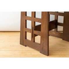 a wooden table sitting on top of a hard wood floor