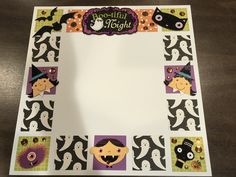 a halloween themed photo frame made out of paper