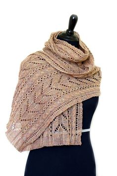 a knitted shawl on a mannequin