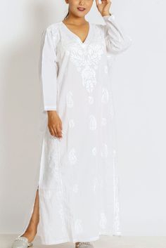 "Our Amrita Embroidered Caftan is hand embroidered by women artisans in Uttar Pradesh, India. The embroidery motifs are first block-printed onto the garment and then the women do the embroidery in their homes, which allows them to do the work on their own schedule between other household work. These soft embroidered cotton caftans feature embroidery on the front and back and are designed for a comfortable, elegant fit, with side slits. One size fits most One Size Fits Most, 50\" Length." White Caftan, White Kaftan, Embroidered Caftan, White Nightgown, Cotton Caftan, Handmade Fair, Do The Work, Embroidery Motifs, Caftan Dress