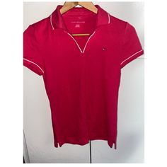 Brand New Tommy Polo Shirt Embroidered Flag At Chest Point Collar Approx:25-1/2” Long V-Neck Shirt Color Is Like A Hot Pink Due To The Flash It Looks More Darker Casual Red Top With Collared Neckline, Red Casual Top With Collared Neckline, Classic Pink V-neck Top, Fitted Short Sleeve Tommy Hilfiger Polo Shirt, Fitted Tommy Hilfiger Polo Shirt With Short Sleeves, Fitted Tommy Hilfiger Casual Polo Shirt, Casual Fitted Tommy Hilfiger Polo Shirt, Tommy Hilfiger V-neck Tops, Fitted Tommy Hilfiger Polo Collar Top