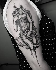 a woman with a tattoo on her arm