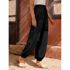 Embrace the rhythmic allure of the desert with our Bedouin Arabian Baggy Pants, meticulously crafted to elevate your dance experience and infuse your leisure moments with effortless style. Designed with the passionate dancer in mind, these pants are perfect for a variety of traditional dances, including the spirited Arabian dancing, the expressive belly dancing, and the lively Dabke dancing. Each movement is a celebration of culture, and our pants are created to honor that tradition.Crafted from sumptuous French Terry fabric, a luxurious blend of 95% polyester and 5% spandex, these pants promise both comfort and durability. The fabric's weight of 230g/m² strikes the ideal balance between lightness and substance, ensuring a graceful flow with every step you take. The regular fit, complement Bohemian Summer Dance Bottoms, Black Baggy Ankle-length Harem Pants, Black Harem Bottoms For Spring, Black Ankle-length Pants With Elastic Waistband, Bohemian Black Pants, Black Summer Parachute Pants With Elastic Waistband, Black Parachute Pants With Elastic Waistband For Summer, Black Full-length Bohemian Harem Pants, Black Bohemian Ankle-length Pants