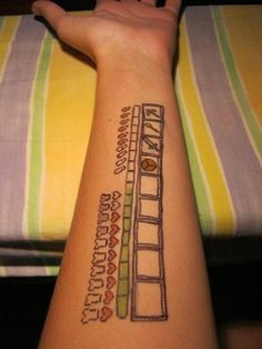 a person with a tattoo on their arm that has writing on the side of it