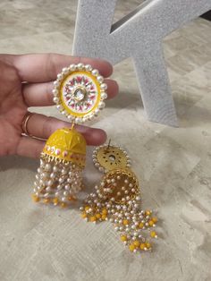 Mustard Yellow Earrings, Yellow Traditional Wear With Meenakari For Wedding, Yellow Meenakari Traditional Wear For Festivals, Wedding Chandbali Jhumkas With Dori Work, Chandbali Jhumkas With Dori Work For Wedding, Diwali Chandbali Jhumkas With Dori Work, Chandbali Jhumkas With Latkans For Puja, Gold Jhumkas For Festive Occasion, Yellow Meenakari Dupatta For Puja