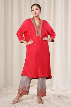 Light red kaftan style kurta with mirror, thread and sequins embroidered neckline and cuffs. Comes with pant. - Aza Fashions Anarkali Salwar Kameez With Embroidered Neckline For Eid, Bollywood Style Kurta With Embroidered Neckline For Diwali, Diwali Traditional Wear Straight Kurta With Embroidered Neckline, Bollywood Style Embroidered Salwar Kameez For Wedding, Festive Bollywood Salwar Kameez With Embroidered Neckline, Bollywood Style Embroidered Wedding Salwar Kameez, Bollywood Wedding Salwar Kameez With Embroidered Neckline, Eid Anarkali Traditional Wear With Embroidered Neckline, Red Straight Kurta With Mirror Work