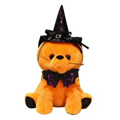 a stuffed animal with a witches hat on it's head and bow tie around its neck