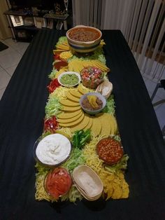 a long table with many different foods on it