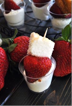 some strawberries and other desserts on a table