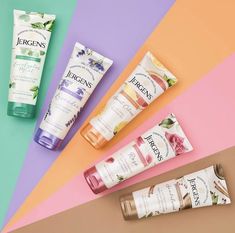 three different types of hand creams on a multi - colored background with the same product