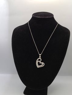 925 Silver Cubic Zirconia Double Heart Pendant Necklace Item w#2408 Clean and in good condition  18 inch chain with a spring ring clasp  1 inch pendant Marked 925 Welcome to Westgate Jewels!! We specialize in vintage estate, designer, and fine jewelry. Our shop consists of items that are estate, antique, and / or vintage conditions unless otherwise noted. This means that most items are prior owned and may have some imperfections such as light scratches, scuffs, and / or patina. Our items are cle Silver Heart Necklace With Sparkling Stones, Silver Diamond Pendant Necklace For Valentine's Day, Silver Heart Pendant Necklace With Sparkling Stones, Silver-tone Heart Cut Diamond Necklace As A Gift, Silver Cubic Zirconia Heart Pendant Necklaces, Silver Heart-shaped Cubic Zirconia Diamond Necklace, Silver Heart Pendant Necklace For Anniversary, Silver Necklaces With Heart Charm In Cubic Zirconia, Silver Necklace With Heart Charm In Cubic Zirconia