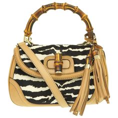 Used Gucci New Bamboo Pony/Leather Shoulder Handbag Zebra Pattern 254884 With Strap 0857gucci (Sku: Gzl13q32) === General === Brand : Gucci === Design === Type : Handbag Material : Leather Leather/Fur Type : Harako Color : Beige Gender : Women === Size === Size (Hxwxd) : 17cm X 27cm X 11cm / 6.69'' X 10.62'' X 4.33'' === Included Items === Accessories : Charm, Mirror, Shoulder Strap Accessories Notice : Before Purchasing, Please Refer To The Images Of The Accessories Included With The Item. === Gucci Shoulder Bag With Bamboo Handle For Shopping, Gucci Top Handle Shoulder Bag With Bamboo Handle, Chic Gucci Shoulder Bag With Bamboo Handle, Designer Gucci Shoulder Bag With Bamboo Handle, Brown Gucci Bag With Bamboo Handle, Zebra Pattern, Gucci Bamboo, Leather Shoulder Handbags, Gucci Models