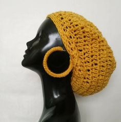 Yellow Slouchy Beanie with Matching Hoop Earrings. Need to look fabulous this season? Well do so in this matching hat and earring set! Slouchy Beanie and earrings are made with soft acrylic yarn. Give your hair a break and still look stylish!  Slouchy Beanie fits adults size head between 22"-25". Material is soft and stretches. Earrings are crocheted over a 3" gold hoop earring. Want it in a different color? Message me.   **Please allow 3-5 days for creation and shipping.** Shipping cost include Handmade Adjustable Gold Hats, Handmade Adjustable Crochet Hat For Festivals, Adjustable Yellow Crochet Hat For Festivals, Trendy Handmade Hat, One Size, Trendy Handmade Hat One Size, Trendy Handmade Hats In One Size, Trendy Handmade One-size Hats, Handmade Trendy Crochet Hat For Festivals, Trendy Handmade Crochet Hat For Festivals