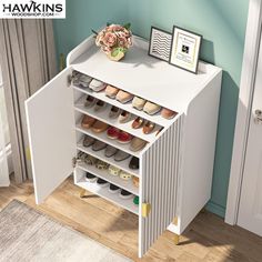 a white shoe rack sitting on top of a wooden floor