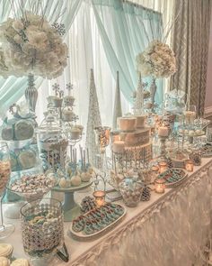 a table topped with lots of cakes and desserts