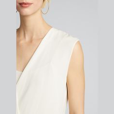 Theory shell with draped-front bodice. Surplice neckline. Sleeveless. Relaxed silhouette. Pullover style. Silk. Unlined. Imported. Sleeveless Silk Top With Ruched Detail, Sleeveless Silk Ruched Top, Sleeveless Ruched Silk Top, Elegant Sleeveless Ruched Tops, Elegant Drapey Sleeveless Top, Formal Sleeveless Ruched Top, Chic Sleeveless Drapey Dress, Chic Drapey Sleeveless Dress, Sleeveless Drapey Evening Dress