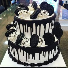 a black and white cake with oreo cookies on top