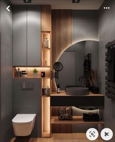 a bathroom with a toilet, sink and mirror in it's corner area next to a wooden shelf