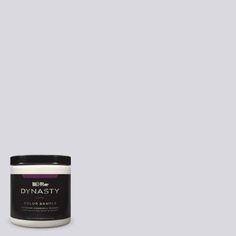 a jar of dymasty colorante on a gray background with the word dymasty written in black