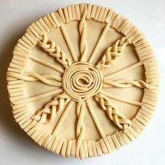 an intricately carved piece of food on a white surface