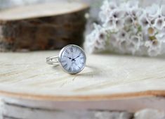 Gentle vintage clock dial ring on a silver tone setting covered with a glass dome.  Not an actual clock. Glass dome with printed picture. Measurements *Size of the round base is 0.47 inch in diameter (12mm), the ring is adjustable and would fit any size.  Materials * High quality picture is transferred to the ring base and covered with a glass dome.  Did you like this design? Find something similar!  More rings → http://etsy.me/2hYYzEI Looking for something more personalised?  Custom item request | Different quantity | Chain/cord length | Contact us → http://etsy.me/2wDBYjx Clock Ring, Ring Clock, Compass Jewelry, Face Ring, Trendy Nail Art Designs, Retro Ring, Trendy Nail, Clock Face, Vintage Clock