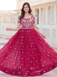 Embrace the vibrant elegance of this rani pink georgette gown, exquisitely embellished with dazzling sequin embroidery work. Designed to make you stand out, this gown is perfect for sangeet ceremonies and other grand celebrations. Fully stitched and available in sizes XS to XXL, it ensures a perfect fit for all body types. With a 3.5-meter flair that adds a graceful flow and a gown length of 56 inches, this piece promises a striking and elegant silhouette.
Ideal for a variety of occasions such a Floor-length Gown With Dori Work For Diwali, Semi-stitched Georgette Gown With Zari Work, Sequin Gown For Eid Reception, Festive Chinon Dress With Sequins, Festive Sequin Dress In Chinon, Eid Reception Party Wear Gown, Festive Sequined Chinon Dress, Embellished Maxi Dress For Party And Festivals, Anarkali Gown With Zari Work In Georgette