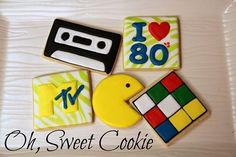 decorated cookies are arranged in the shape of an audio cassette, i love 80 and pacman