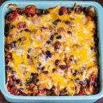 a tray filled with nachos covered in cheese and chili