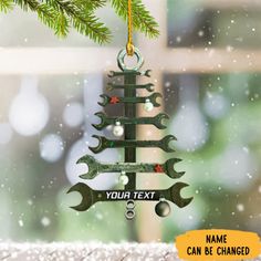 a christmas tree ornament with wrenches hanging from it