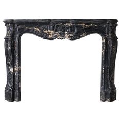 an antique black marble fireplace mantel