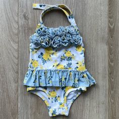 Adorable Mudpie One Piece Swimsuit With Blue And Yellow Rose Floral Print And Ruffle Around Waistline, Size 6-9 Months. Button Closure For Easy Diaper Changes! Nwot Kids Mud, 9th Month, Mud Pie, Kids Swimming, Blue And Yellow, Yellow Roses, Yellow Rose, Blue Yellow, One Piece Swimsuit