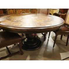 a dining table with chairs around it in a room filled with antiques and wood paneling